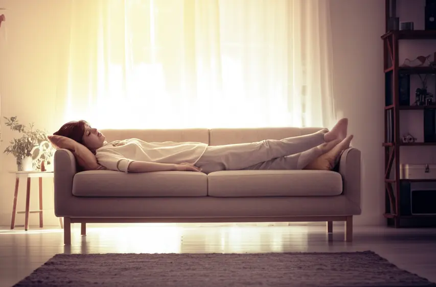 378_a-sunny-room-with-a-cozy-couch-and-a-person-napping-peacefully-1745223177966